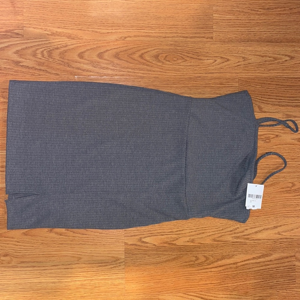 Short knit dress with small minor slit on the left side corner